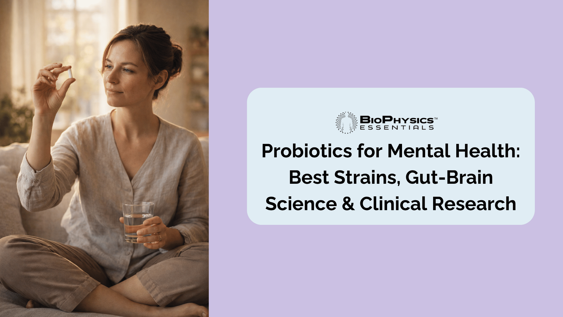 Woman in her mid-30s sitting in morning light on a linen couch, holding a probiotic supplement capsule with a calm and intentional expression