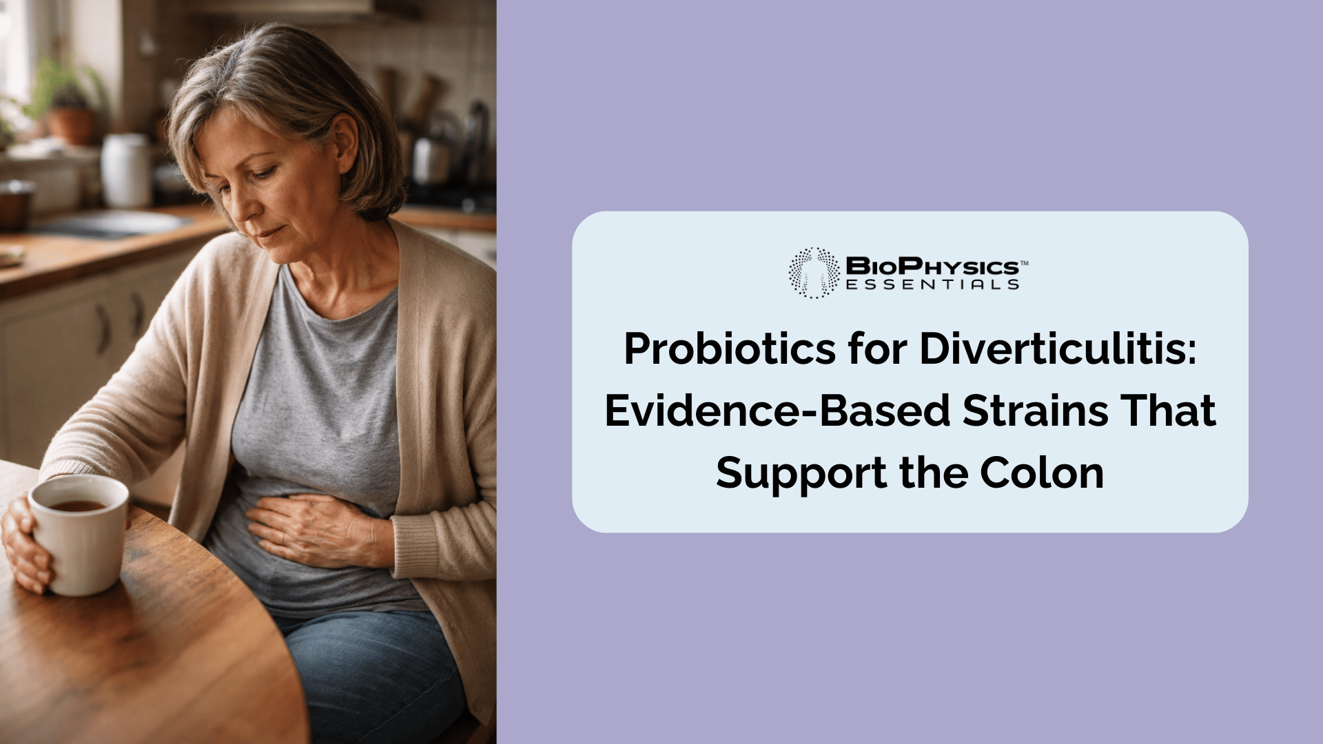 Person sitting at kitchen table holding their lower abdomen with a cup of tea, representing the quiet discomfort of living with diverticular disease